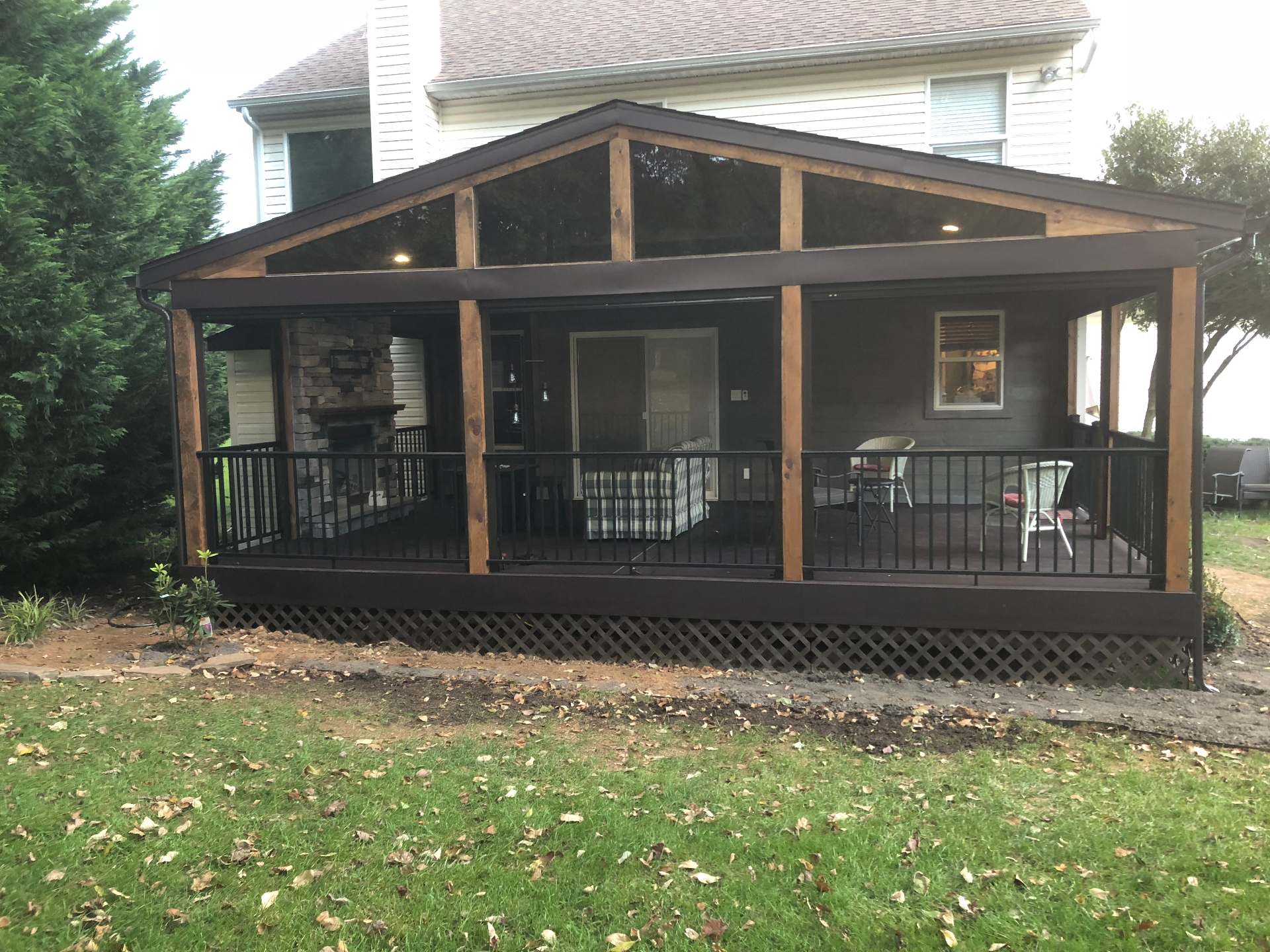 Gray composite deck with cable railing and matching stairs